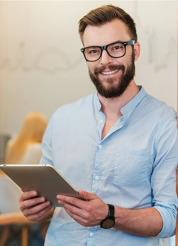 Content image - man holding ipad and smiling